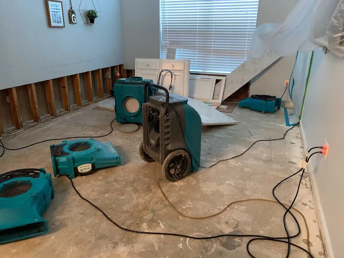 Dehumidifier in flood-cut room for Water Damage Restoration in Jordan
